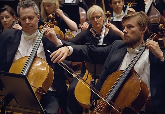 Close up on a man playing the cellist. From the concert.