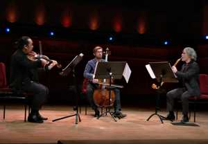 Three musicians playing. From the movie