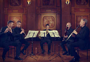 Four people playing chamber music. From the concert.