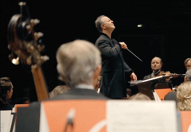 Happy man conducts. From the concert.